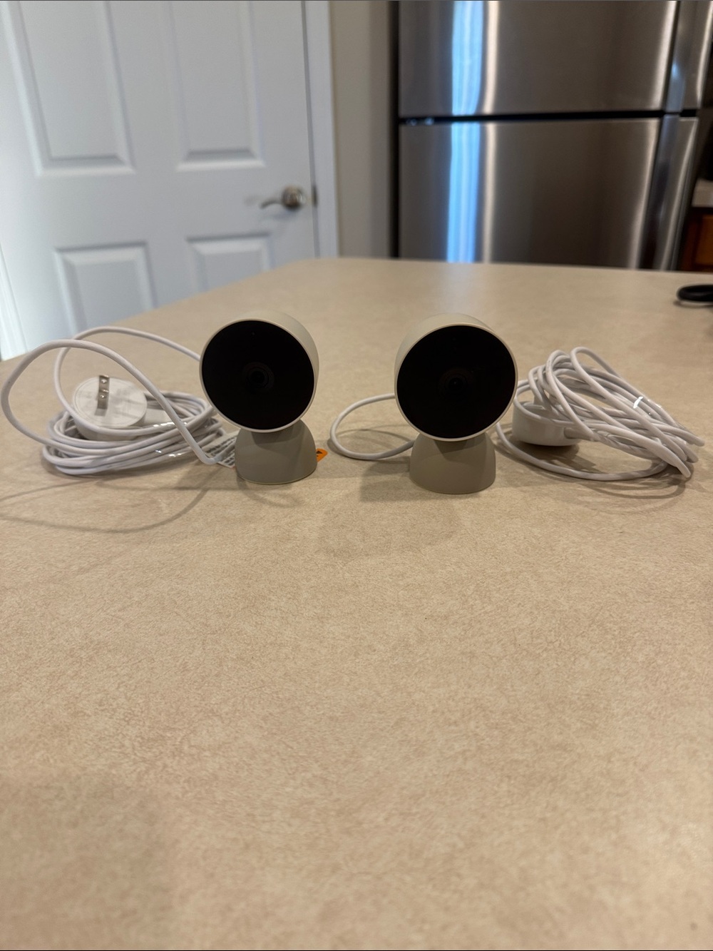 Pair of White Wired Indoor Security Cameras with Adjustable Stands